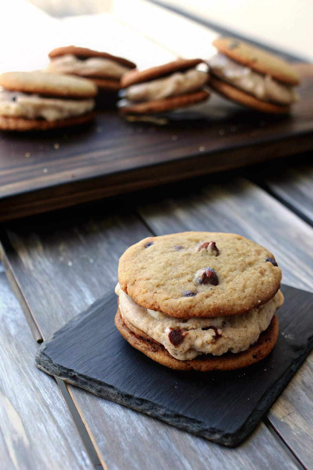 Chocolate Chip Cookie Sandwiches with Nutella Cream Cheese Filling slice on plate showing perfect texture and swirl pattern