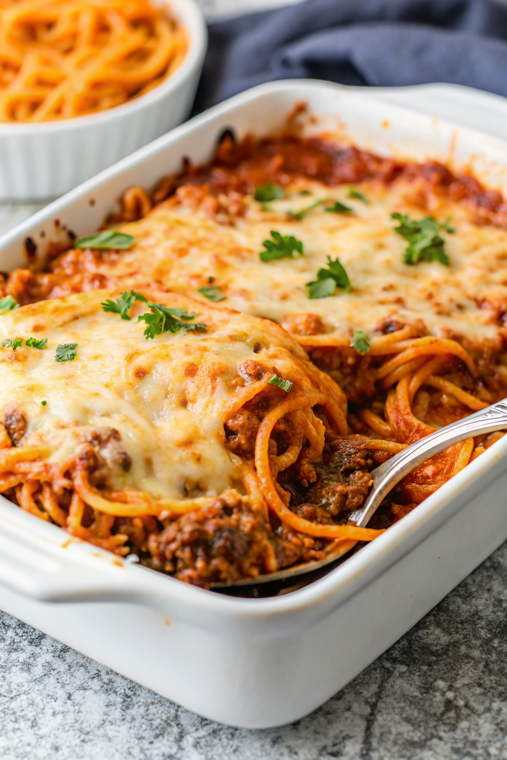 Spaghetti Bake slice on plate showing perfect texture and swirl pattern