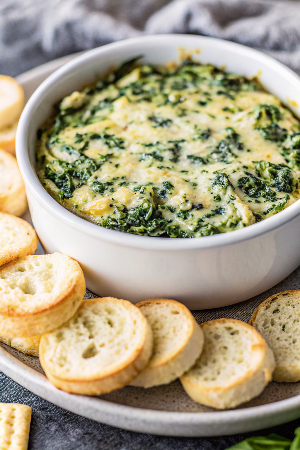 Spinach Artichoke Dip slice on plate showing perfect texture and swirl pattern